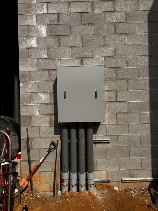 Commercial electrical service panel and conduits