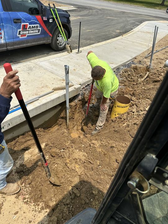 Electrician completing outdoor electrical rough-in